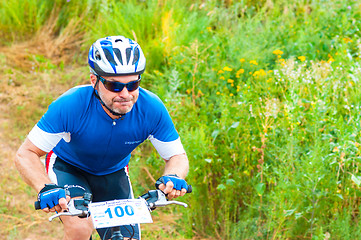 Image showing Competitions cyclists in cross-country 