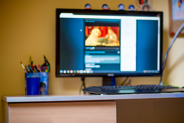 Image showing blurred background of childs room with computer at home