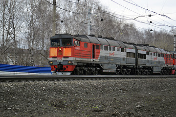 Image showing The engine of gray color moves on railway tracks.