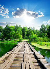 Image showing Sun over wooden bridge