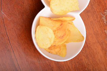Image showing Potato chips. Close up, unhealthy food concept
