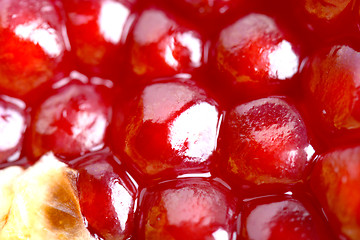 Image showing Pomegranate background. Macro of peeled ripe seeds