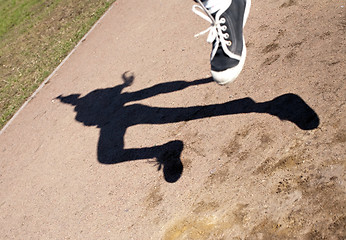 Image showing human shadow in flying jump