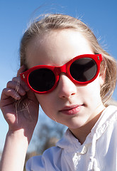 Image showing young funny girl in sunglasses