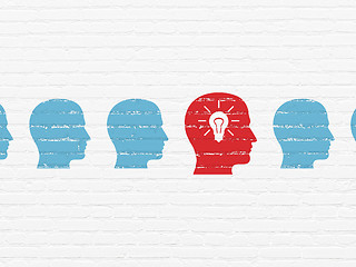 Image showing Finance concept: head with light bulb icon on wall background