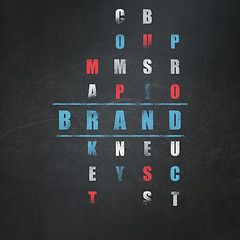 Image showing Advertising concept: word Brand in solving Crossword Puzzle