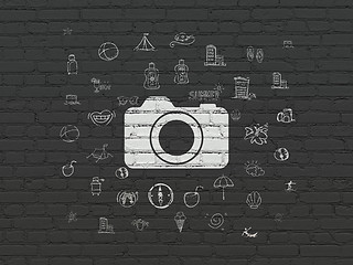Image showing Tourism concept: Photo Camera on wall background