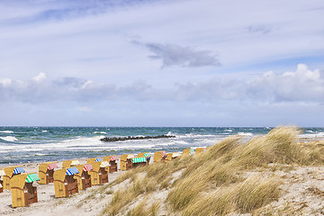 Image showing Beach chairs with dunes at Wustrow