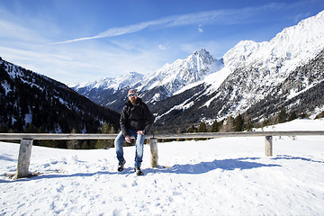 Image showing Young man enjoys winter landscape 