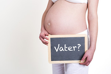 Image showing Pregnant woman with German word father on blackboard