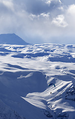 Image showing Speed flying in winter evening mountains