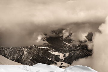 Image showing Sepia snowy mountains in clouds