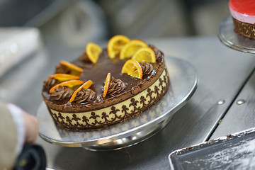 Image showing chef preparing desert cake in the kitchen