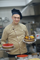 Image showing chef preparing desert cake in the kitchen