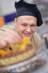 Image showing chef preparing desert cake in the kitchen