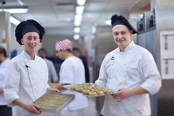 Image showing chef preparing desert cake in the kitchen