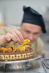 Image showing chef preparing desert cake in the kitchen