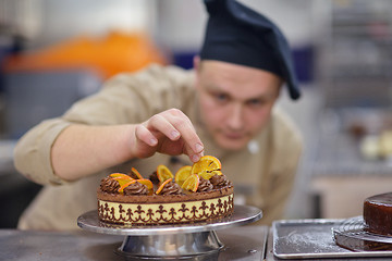 Image showing chef preparing desert cake in the kitchen