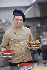 Image showing chef preparing desert cake in the kitchen