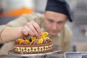 Image showing chef preparing desert cake in the kitchen