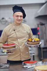 Image showing chef preparing desert cake in the kitchen