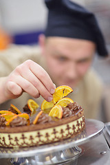 Image showing chef preparing desert cake in the kitchen