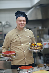 Image showing chef preparing desert cake in the kitchen