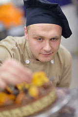 Image showing chef preparing desert cake in the kitchen