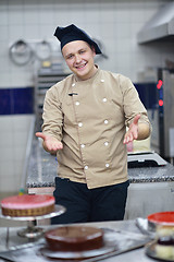 Image showing chef preparing desert cake in the kitchen