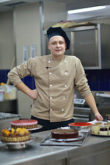 Image showing chef preparing desert cake in the kitchen