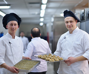 Image showing chef preparing desert cake in the kitchen