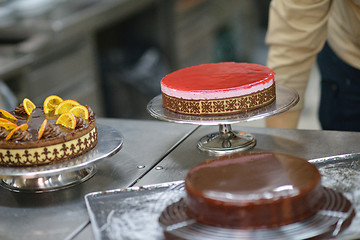 Image showing chef preparing desert cake in the kitchen