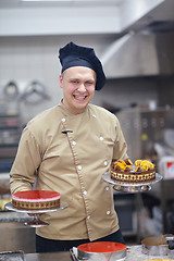 Image showing chef preparing desert cake in the kitchen