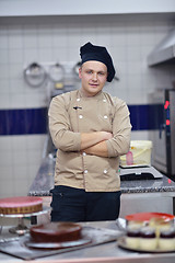 Image showing chef preparing desert cake in the kitchen