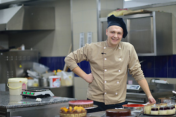 Image showing chef preparing desert cake in the kitchen