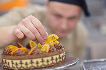 Image showing chef preparing desert cake in the kitchen