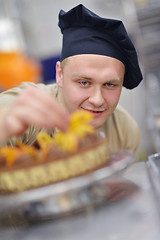 Image showing chef preparing desert cake in the kitchen