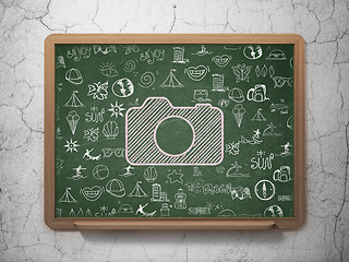 Image showing Vacation concept: Photo Camera on School Board background