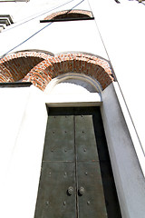 Image showing caiello    knocker in a  door curch  closed wood italy  lombardy