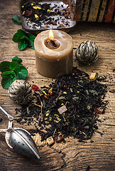 Image showing tea brew with lime and mint on wooden background 