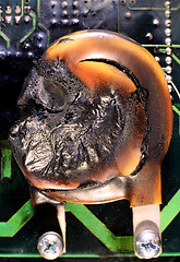 Image showing MOV, Metal Oxide Varistor burnt by thunder and lightning.