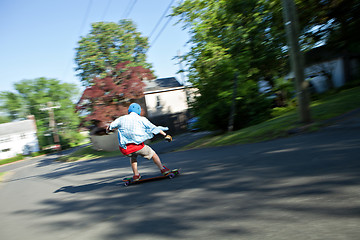 Image showing Longboarder Speeding Downhill