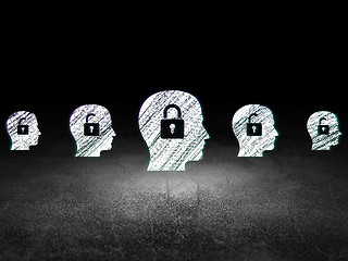Image showing Protection concept: head with padlock icon in grunge dark room