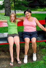 Image showing Family on swings