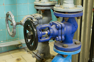 Image showing Pipes and faucet valves of heating system in a boiler room