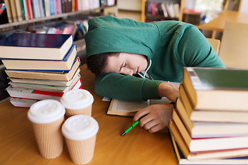 Image showing tired student or man with books in library