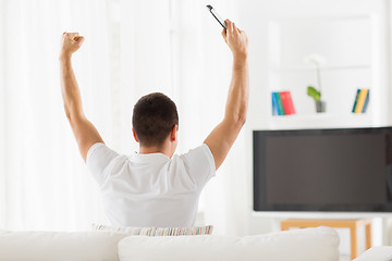 Image showing man watching tv and supporting team at home