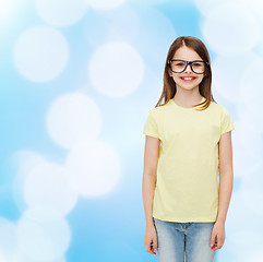 Image showing smiling cute little girl in black eyeglasses