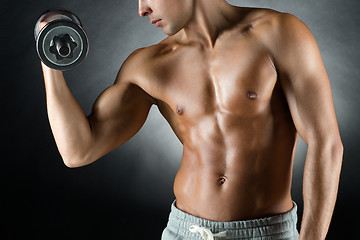 Image showing young man with dumbbell