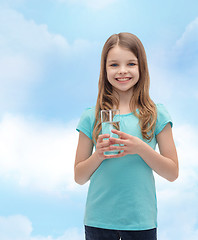 Image showing smiling little girl with glass of water